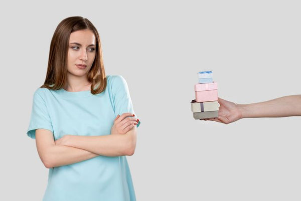 A woman unhappy with small Christmas gifts