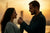 A man giving his girlfriend a gift.