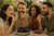 A group of friends eating Israeli fruits.