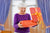 Grandmother opening a Christmas gift