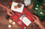 Artza subscription gift box  from the holy land a person opening a christmas present on a table